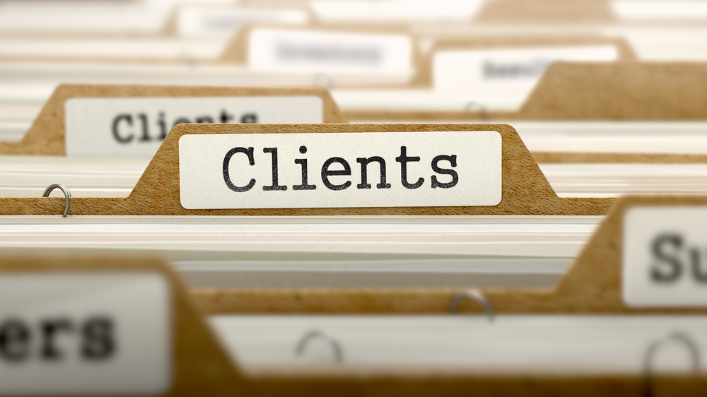 Folders with clients written on it