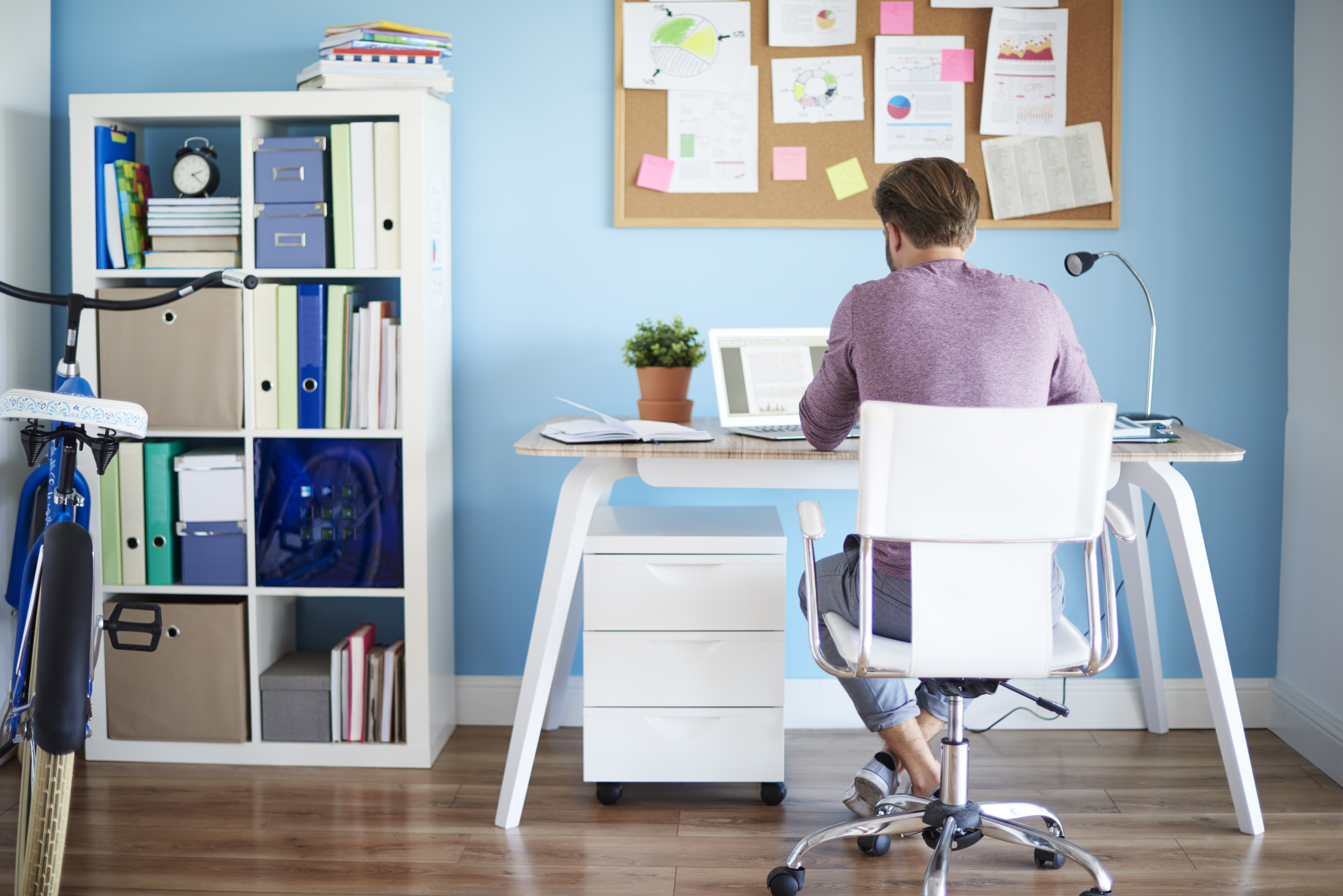 Man sitting at desk showing the concept of hybrid working